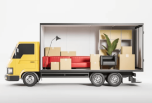 camion dei traslochi con al suo interno un divano, una pianta, diversi scatoloni
